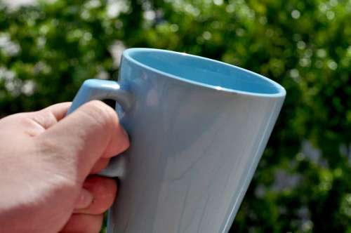 ceramica Mano Sosteniendo una Taza