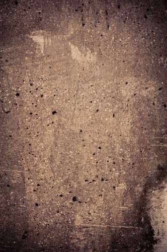 Textura de pared sucia con pequeñas manchas negras