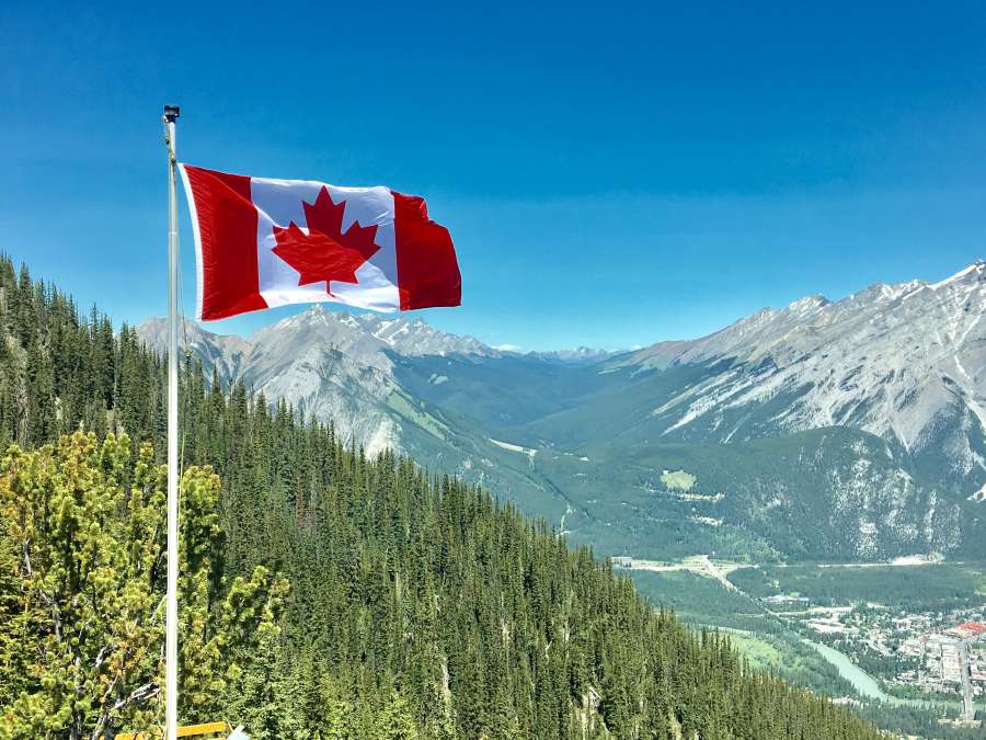 venture  alpine  canada  cold  daylight  flag  frozen  glacier  high  landscape  mountain  mountain peak  national  nature  outdoors  pole  rocky  scenery  scenic  sky  snow  travel  trees  valley  victoria day  winter